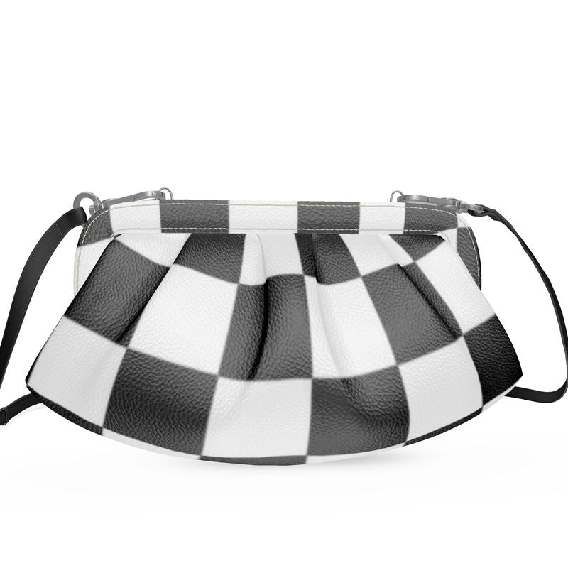 Designer pleated soft frame bag in black and white checkered pattern with detachable shoulder strap.