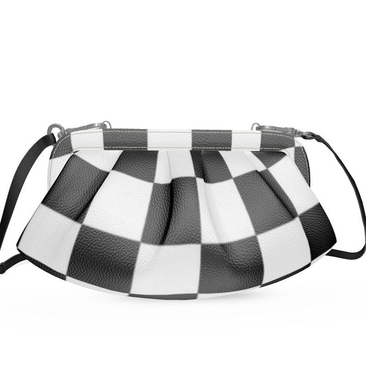 Designer pleated soft frame bag in black and white checkered pattern with detachable shoulder strap.